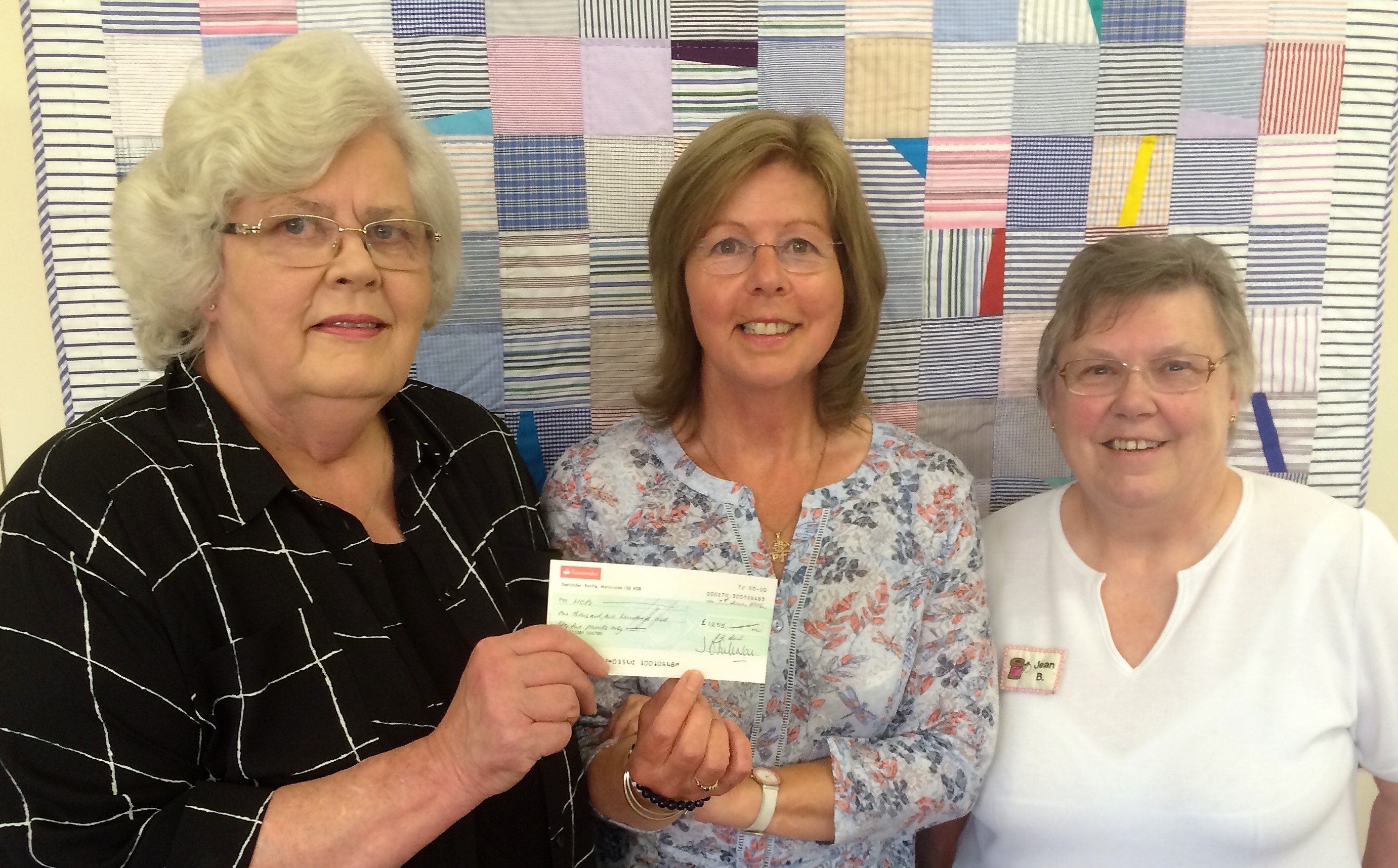 Presentation of Cheque for £1255 to Oakhaven Photo of the Mother's Day workshop